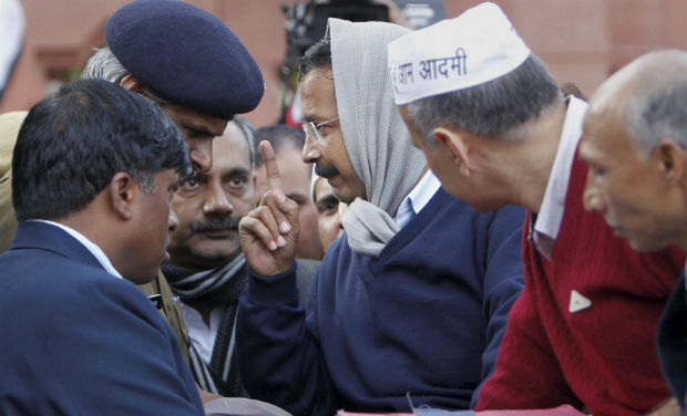 Delhi Chief Minister Arvind Kejriwal with his cabinet colleague Manish Sisodia at his dharna demanding action against police personnel, near Rail Bhavan in New Delhi on Monday - PTI Delhi Chief Minister Arvind Kejriwal with his cabinet colleague Manish Sisodia at his dharna demanding action against police personnel, near Rail Bhavan in New Delhi on Monday - PTI
